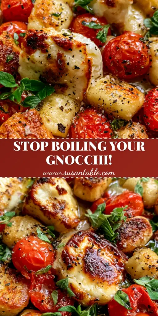A top-down view of a weathered dark metal sheet pan filled with golden-brown roasted gnocchi, blistered red cherry tomatoes, and charred feta cheese chunks garnished with fresh oregano. (Greek Sheet Pan Gnocchi)