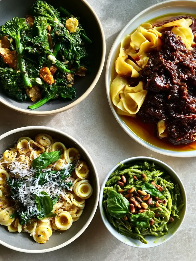 Italian pasta regional guide: Master the Art of Three Iconic Classics 1 Twisted trofie pasta coated in bright emerald-green basil pesto with toasted pine nuts and fresh basil garnish.